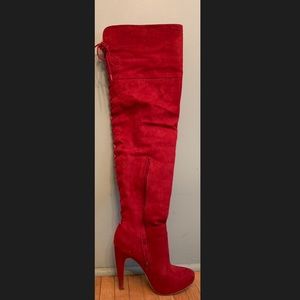 Thigh high red heeled boots